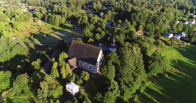 Medieval church, Cinema 4k aerial view all the way around pyhan katarinan kirkko church, on a sunny evening dawn, in Karjaa, Raasepori, Uusimaa, Finland