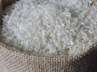 White rice in burlap. Macro