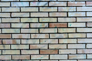 brick wall with single orange bricks close up structure