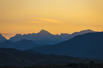 silhouetted mountains before sunrise