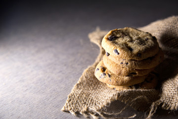 Chocolate chip cookies on rustic background