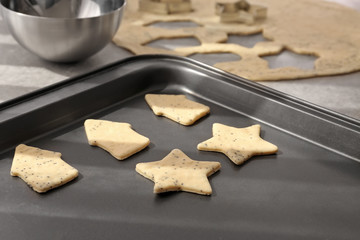 Raw cookies on baking tray, closeup