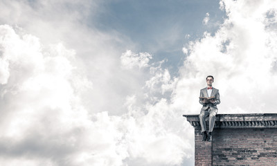 Young businessman or student studying the science on building ro