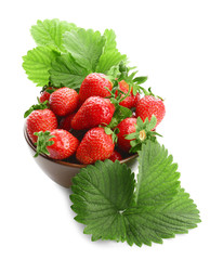 Bowl with delicious perfect strawberry and leaves on white background