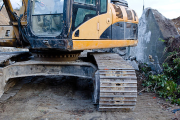 Fototapeta na wymiar part of a veavy building machine , excavator 