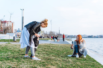 Two women and a little boy on the lake