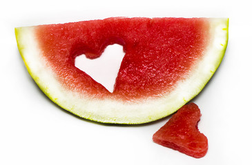 Fresh slice of watermelon with heart isolated on white background