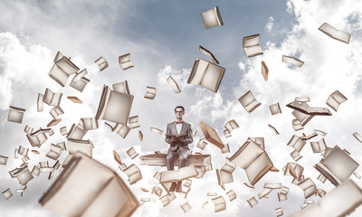 Young businessman or student studying the science and books fly 