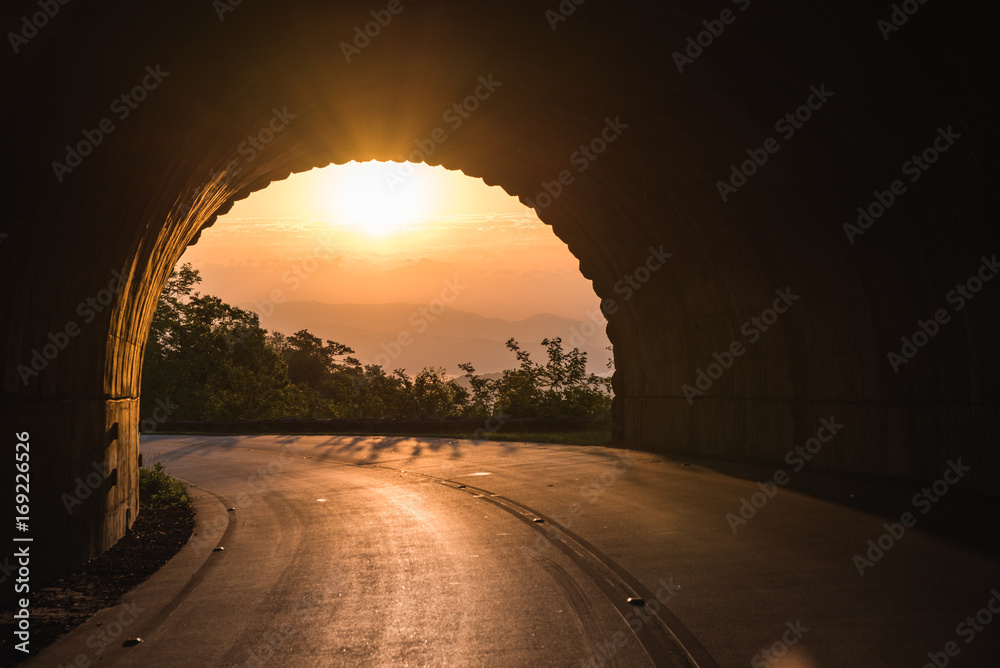 Wall mural sunrise through tunnel on the blue ridge parkway, north carolina