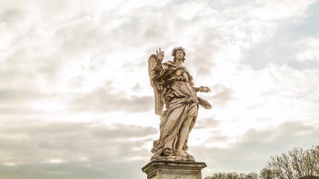 Motion timelapse of Angel sculpture at the Saint Angel's bridge near castle with beautiful sun shine. Rome, Italy. April, 2016.