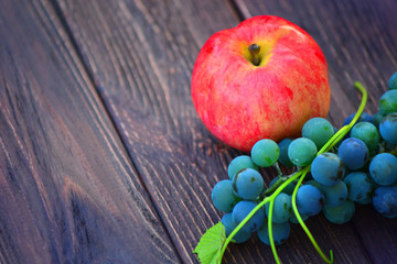 Fresh red apple and young grapes juice