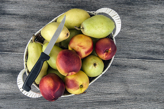 Summer fruit in a fruit basket, pear, apple and nectarine...
web design according pears and nectarines photos

