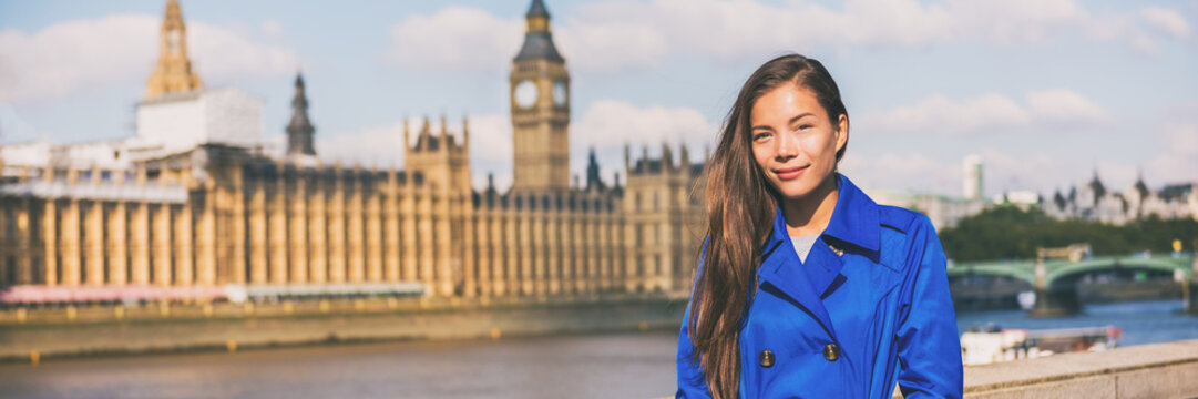 London woman european city traveller banner. Panoramic background of UK travel destination. Europe holiday Asian businesswoman happy in Autumn vacation.