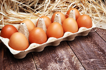 Egg. Fresh farm eggs on a wooden rustic background