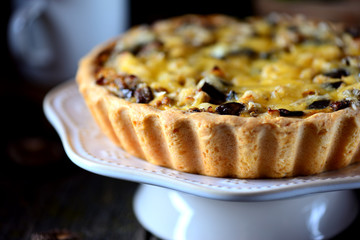 Delicious pie with chicken meat, eggplant, mushrooms, onion and cheese.