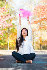 Pink powder cloud above girls face