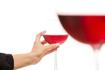 Glasses of red wine in two hands