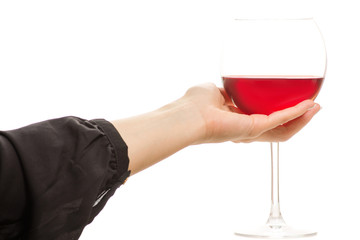 Female hand holding a glass of red wine
