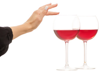 Female hand holding two glasses of red wine