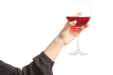 Female hand holding a glass of red wine