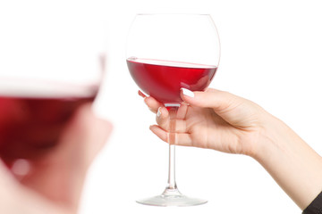 Glasses of red wine in two hands