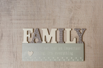 Family concept. Wooden letters ''Family'' with inscription ''Family is not just an important thing, It's everything''