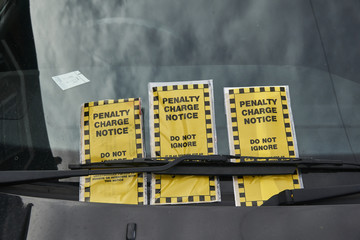 Penalty Charge notices on a car windscreen - obrazy, fototapety, plakaty
