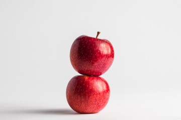 close-up view of fresh red apples on a white background