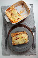 Lasagna Bolognese on a rustic table