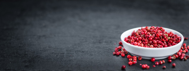 Portion of Pink Peppercorns on a slate slab