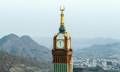 Mecca clock tower - mosque tower - in Mecca - obrazy, fototapety, plakaty