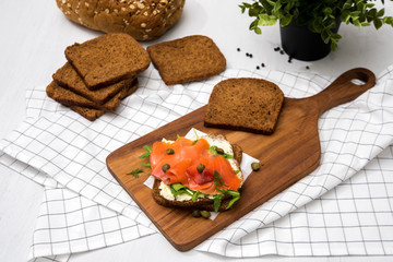 Salmon Sandwich on wooden plate