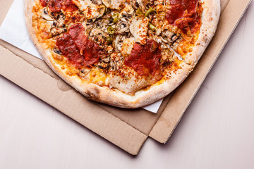 Hot pizza on box.
