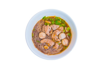 noodle meat ball and pig piece in bowl on table with broth intense. top view isolated oover  white background and clipping path