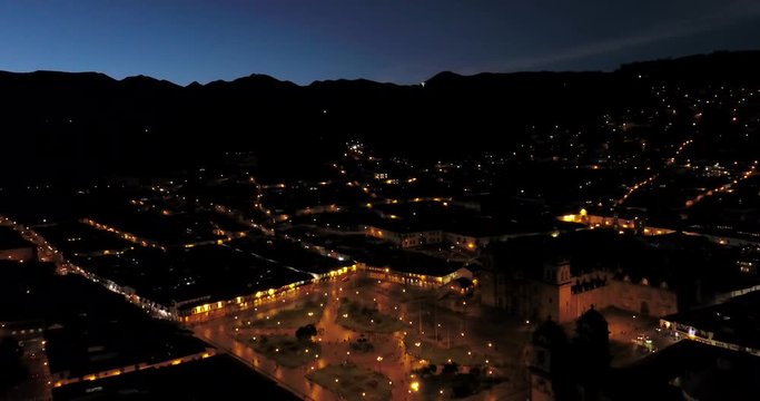 Cusco Peru Aerial v16 Flying low around main plaza at night with skyline views