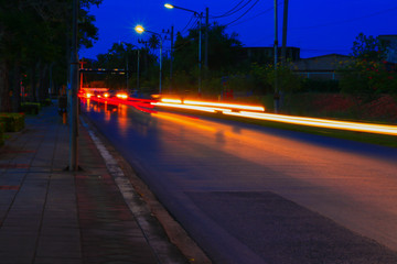 car lights at night in city and headlights. Long exposure with copy space add text