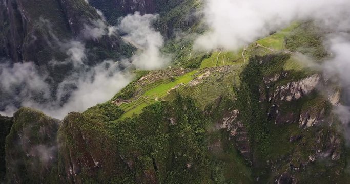 Machu Picchu Peru Aerial v3 Birdseye view flying over ancient ruins panning