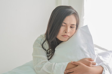 Women with depression  on bed
