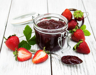 Strawberry jam and fresh strawberries