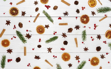Autumn winter pattern composition of branches of an tree, cinnamon, dried orange, anise of stars...