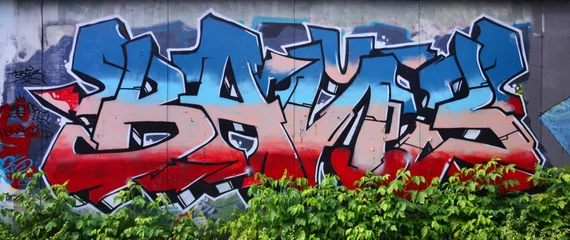 Die alte Mauer, gemalt in Farbe Graffiti zeichnen blaue Aerosolfarben. Hintergrundbild zum Thema Zeichnen von Graffiti und Street Art © mehaniq41