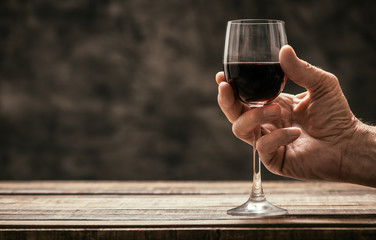 Man tasting a glass of red wine