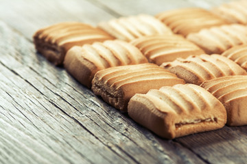 Sweet cookies on wooden background