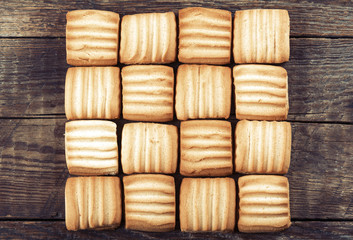 Sweet cookies on wooden background