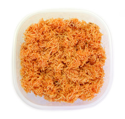 Sweet crispy noodles packed in plastic box isolated on white background.