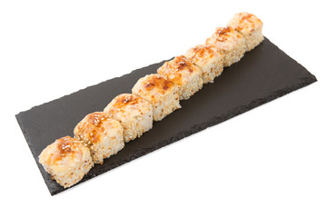 Baked rolls with mayonnaise, cheese, salmon, tuna, smoked eel and shrimp. On a black slate isolated on white background