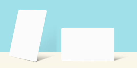 Business Card Mockup in Portrait and Landscape Position present over Blue Wall, 3d image