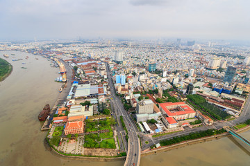 Obraz premium Panoramic view of Ho Chi Minh city (or Saigon) in sunset, Vietnam. Saigon is the biggest city and economic center in Vietnam with population around 10 million people.