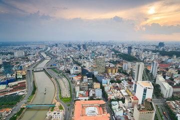 Fototapeta premium Panoramic view of Ho Chi Minh city (or Saigon) in sunset, Vietnam. Saigon is the biggest city and economic center in Vietnam with population around 10 million people.