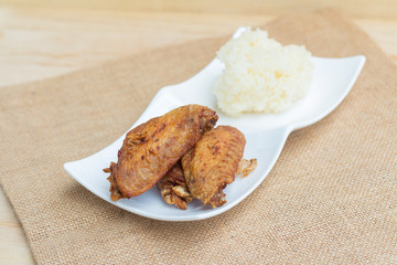 Fried chicken wings and crispy garlic with sticky rice(selective focus)